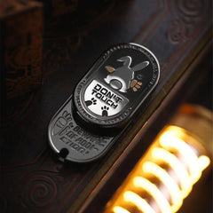 black metal rabbit fidget slider for adults, showing the black finish with white and gold accents