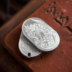 metal dragon fidget slider for adults, close-up of the engraved detail and mechanical push-slide