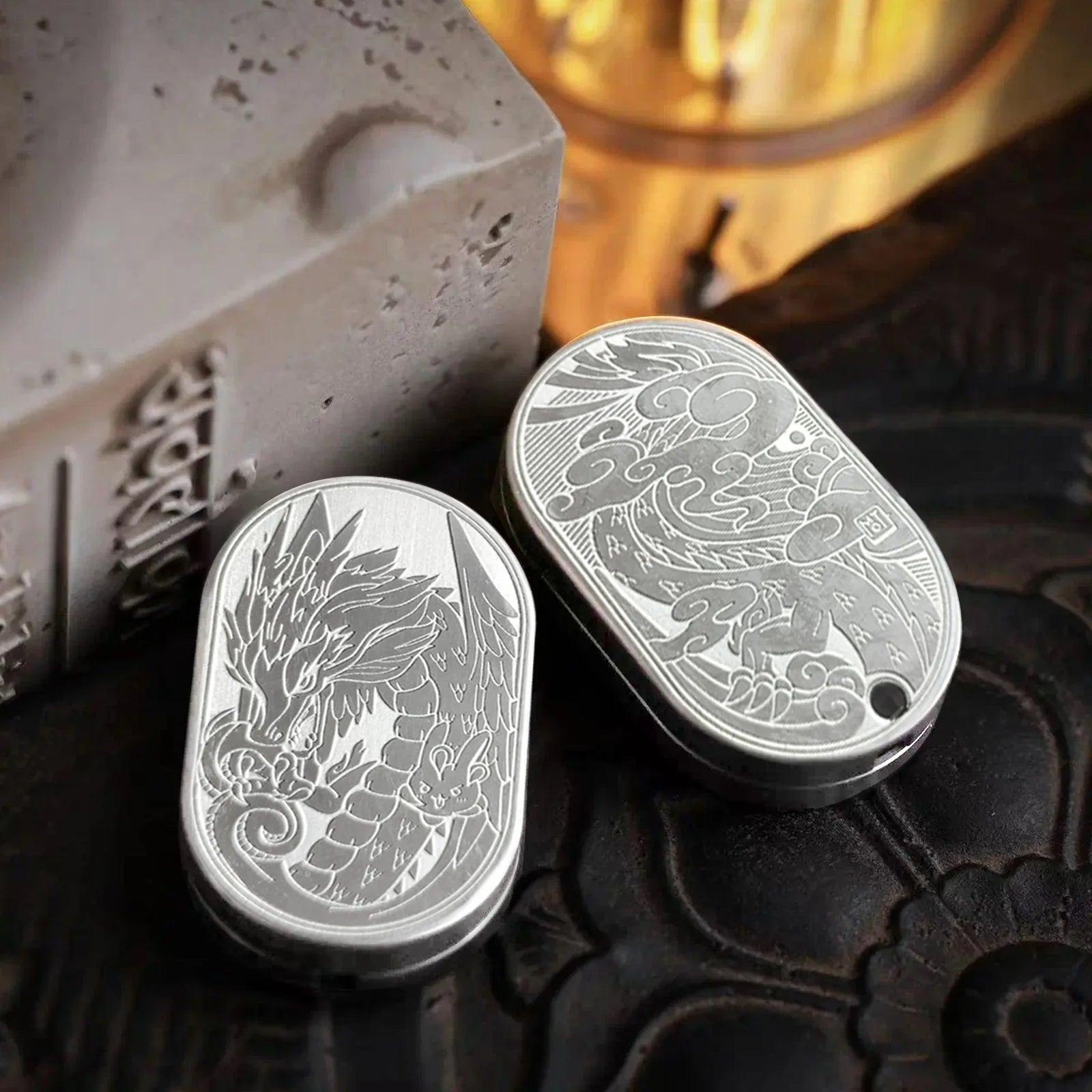 metal dragon fidget slider for adults, held in hand as a compact metal EDC fidget toy