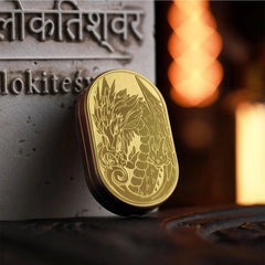 metal dragon fidget slider for adults, on a desk, a pocket-size fidget for restless hands