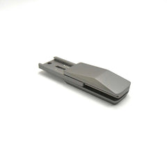 silver-grey metal truck fidget slider for adults, held in hand as a compact metal EDC fidget toy