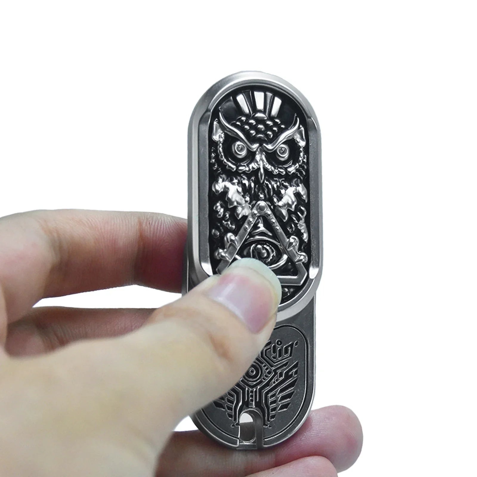 metal rotating magnetic fidget slider with engraved owl design for adults, held in hand as a compact metal EDC fidget