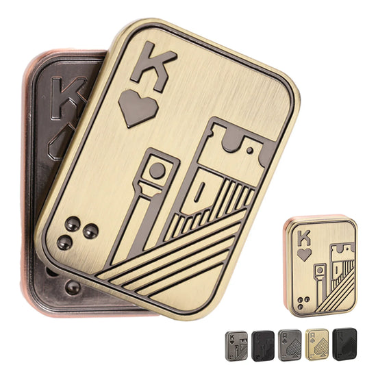 Gold metal poker card fidget slider shaped like the King of Hearts, two stacked cards showing the brushed antique-gold finish