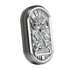 metal rotating magnetic fidget slider with engraved owl design for adults, on a desk, a pocket fidget for restless hands